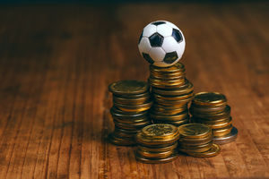 Soccer-bet-concept-with-football-and-money.png