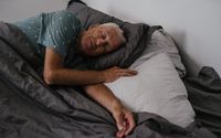 Photo by SHVETS production: https://www.pexels.com/photo/an-elderly-man-sleeping-on-the-bed-8899461/