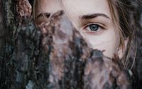 Photo by Elizaveta Dushechkina: https://www.pexels.com/photo/calm-woman-behind-tree-bark-in-park-3727149/