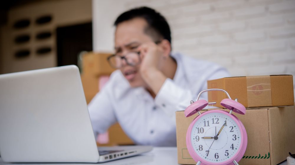 young-man-working-marketing-online-with-laptop-box-post (1).jpg