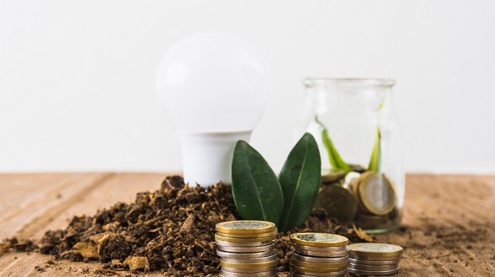 coins-stack-with-light-bulb-jar.jpg