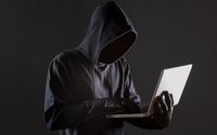 side-view-male-hacker-with-gloves-laptop.jpg