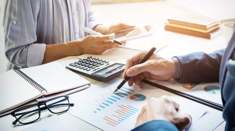 business-man-financial-inspector-secretary-making-report-calculating-checking-balance-internal-revenue-service-inspector-checking-document-audit-concept (1).jpg