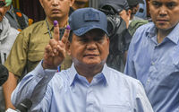 Calon Presiden nomor urut 2 Prabowo Subianto menunjukkan jarinya usai mencoblos suara suara Pemilu 2024 di TPS 033, Kampung Curug, Desa Bojong Koneng