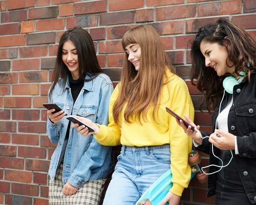 smiling-lot-while-using-mobile-phone.jpg