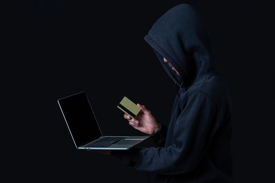 hacker-with-laptop-golden-credit-card.jpg