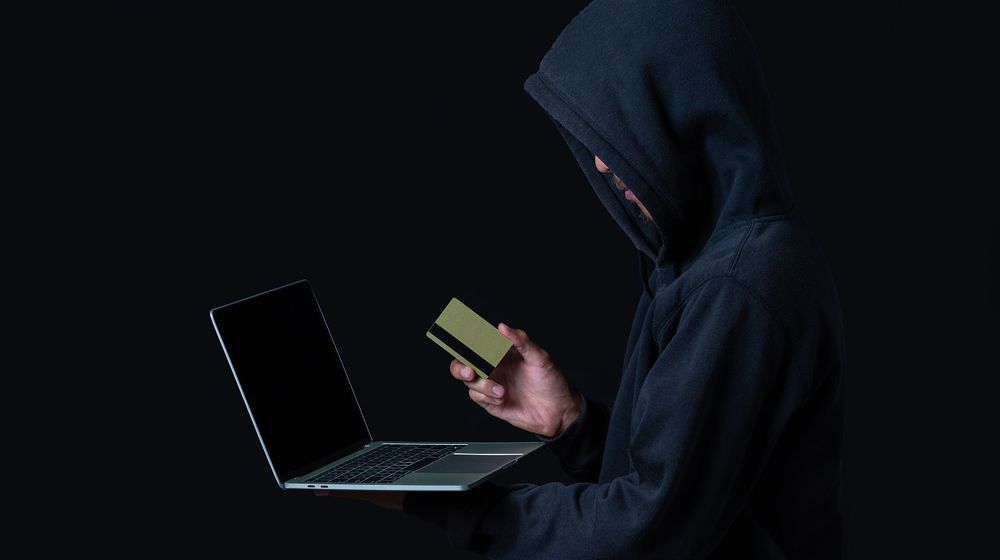 hacker-with-laptop-golden-credit-card.jpg