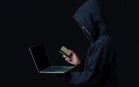 hacker-with-laptop-golden-credit-card.jpg