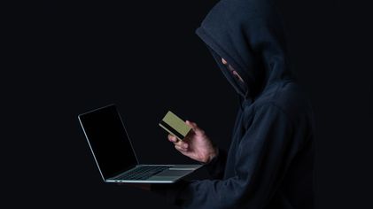 hacker-with-laptop-golden-credit-card.jpg