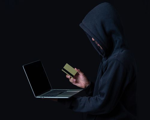 hacker-with-laptop-golden-credit-card.jpg