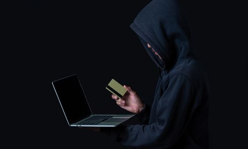 hacker-with-laptop-golden-credit-card.jpg