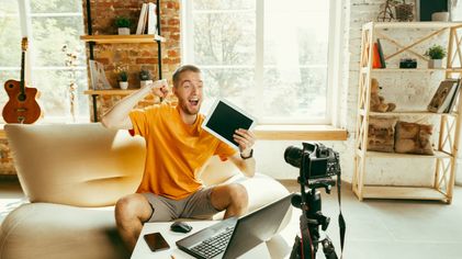 young-caucasian-male-blogger-with-professional-camera-recording-video-review-tablet-home-blogging-videoblog-vlogging-man-making-vlog-live-stream-about-photo-technical-novelty_155003-23139.jpg