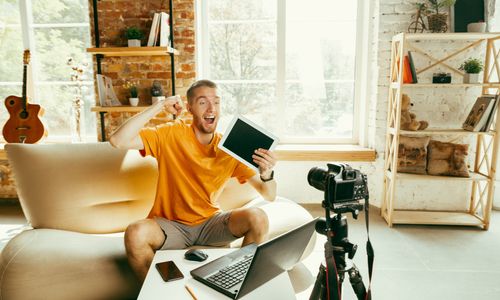young-caucasian-male-blogger-with-professional-camera-recording-video-review-tablet-home-blogging-videoblog-vlogging-man-making-vlog-live-stream-about-photo-technical-novelty_155003-23139.jpg
