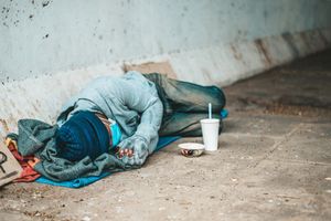 beggars-lying-side-street-with-dirty-clothes_1150-22921.jpg
