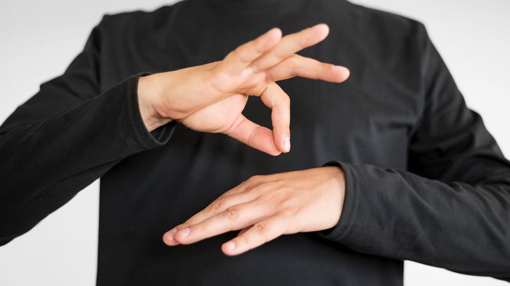 close-up-interpreter-teaching-sign-language.jpg